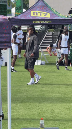 Football throw on turf field at LA sports event