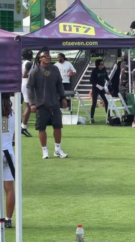 Football throw on turf field at LA sports event