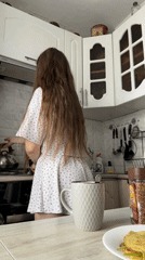 Woman documents morning routine in Russian kitchen