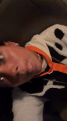 Person films self-portrait while lying down in Porlamar