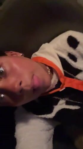 Person films self-portrait while lying down in Porlamar