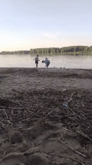 Adult and child spend afternoon at Rusanovo riverbank
