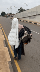 Street-level morning in Jos: commerce, commutes, and city life