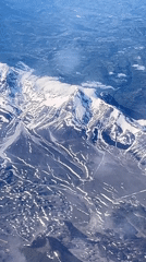 Aerial footage captures snow-covered peaks near Capestrano, Italy
