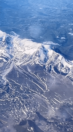 Aerial footage captures snow-covered peaks near Capestrano, Italy