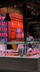Madrid evening captures deli display and building projection mapping