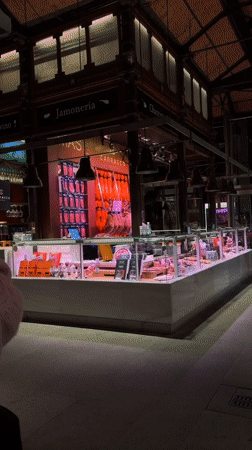 Madrid evening captures deli display and building projection mapping
