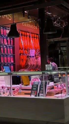 Madrid evening captures deli display and building projection mapping