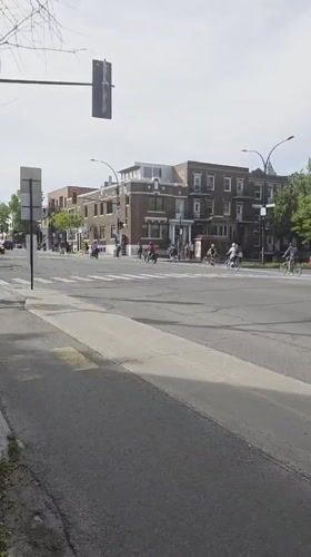 Cyclists ride through busy Montreal intersection Thursday evening