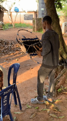 Drumming and dancing at an outdoor gathering in Akwanga