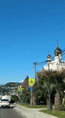 Sunny day captured in Sirius, Russia with church, mountains