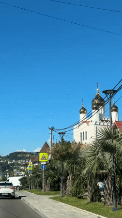 Sunny day captured in Sirius, Russia with church, mountains