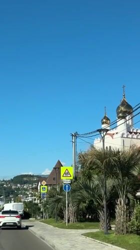 Sunny day captured in Sirius, Russia with church, mountains