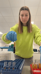 Woman works in Moscow laboratory with test tube equipment