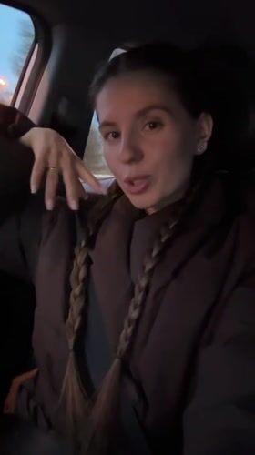 Woman passenger with braids recorded in car in Klin