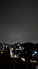 Nighttime views of illuminated Caracas captured from multiple vantage points