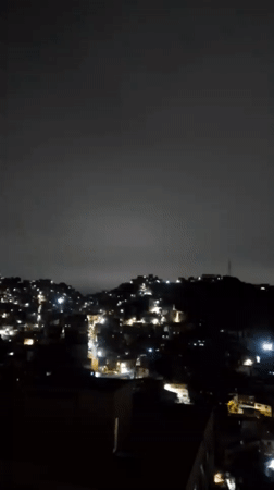 Nighttime views of illuminated Caracas captured from multiple vantage points