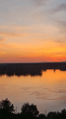 Sunset moments captured along waterway in Ольховка, Russia