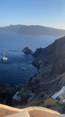 Cats, bells, and Aegean views in Oia, Santorini