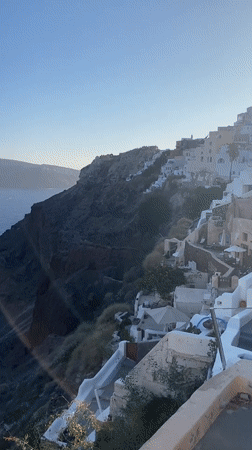 Cats, bells, and Aegean views in Oia, Santorini