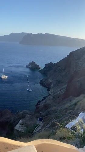 Cats, bells, and Aegean views in Oia, Santorini