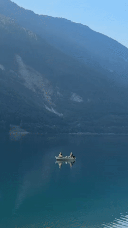 Early morning on Lake Molveno — fishing, running, Dolomite views