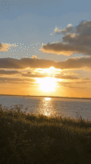 Sunset with vertical clouds observed over Great Yarmouth