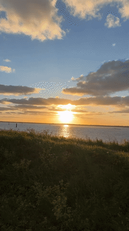Sunset with vertical clouds observed over Great Yarmouth