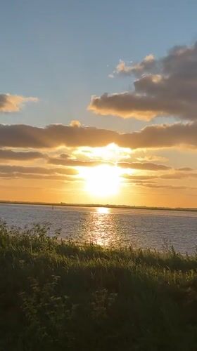 Sunset with vertical clouds observed over Great Yarmouth