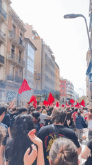 May Day demonstration with red flags marches through Barcelona
