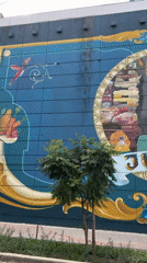 Buenos Aires street scenes feature architecture, murals, resting man