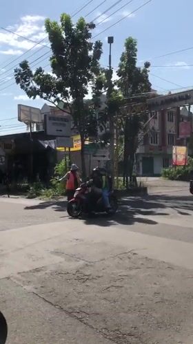 Everyday street activity in Buduran on a June morning