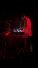 DJ performs at Buenos Aires nightclub with red lighting