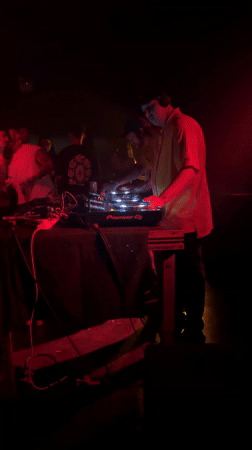 DJ performs at Buenos Aires nightclub with red lighting