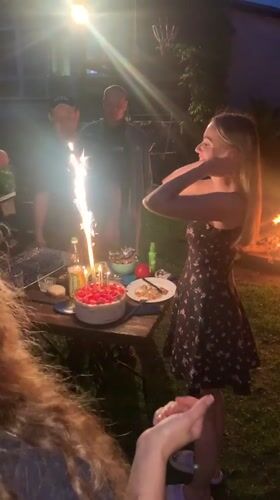 Outdoor birthday party with sparklers and barbecue, rural Russia