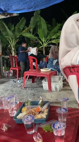 Nighttime wedding celebration with live music in Pulokulon, Indonesia