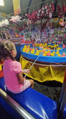 Hooking rubber ducks at a Burgas carnival game
