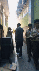 Street-level snapshot of central Malang's mosques, malls, and daily life