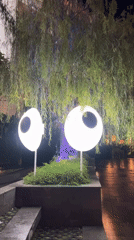 Eye-like decorative lights spotted in Denpasar landscaped area