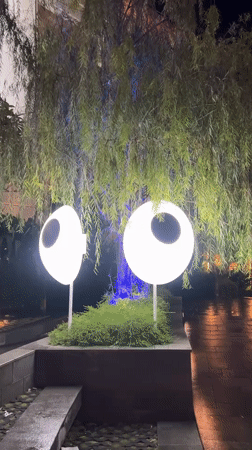 Eye-like decorative lights spotted in Denpasar landscaped area