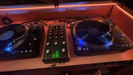 DJ equipment spotted in red-lit Buenos Aires venue