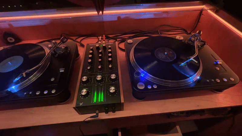 DJ equipment spotted in red-lit Buenos Aires venue