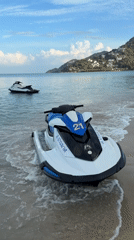 Jet skis moored along a quiet Ko Samui beach.