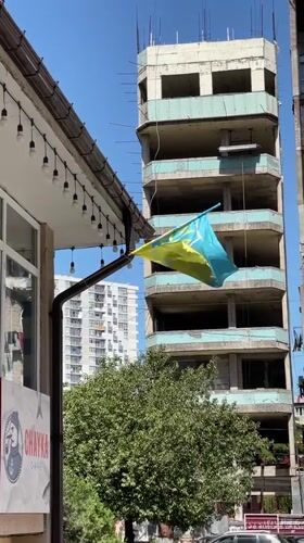 Morning life captured across Batumi: flags, plants, construction, peace signs