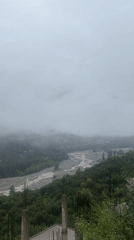Misty morning over Vashisht's river valley and forested hills