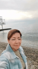 Woman documents coastal city tour across beaches and landmarks