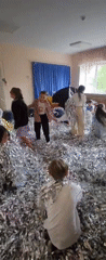 Children play in tinsel-filled room in Krasnogorskoye