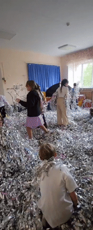 Children play in tinsel-filled room in Krasnogorskoye
