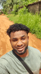 Man records cheerful selfie video on dirt road in Nigeria