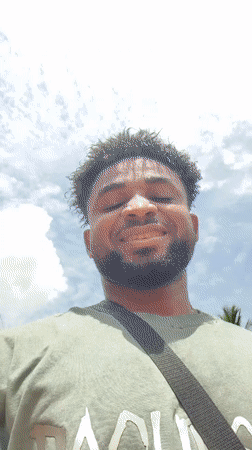 Man records cheerful selfie video on dirt road in Nigeria